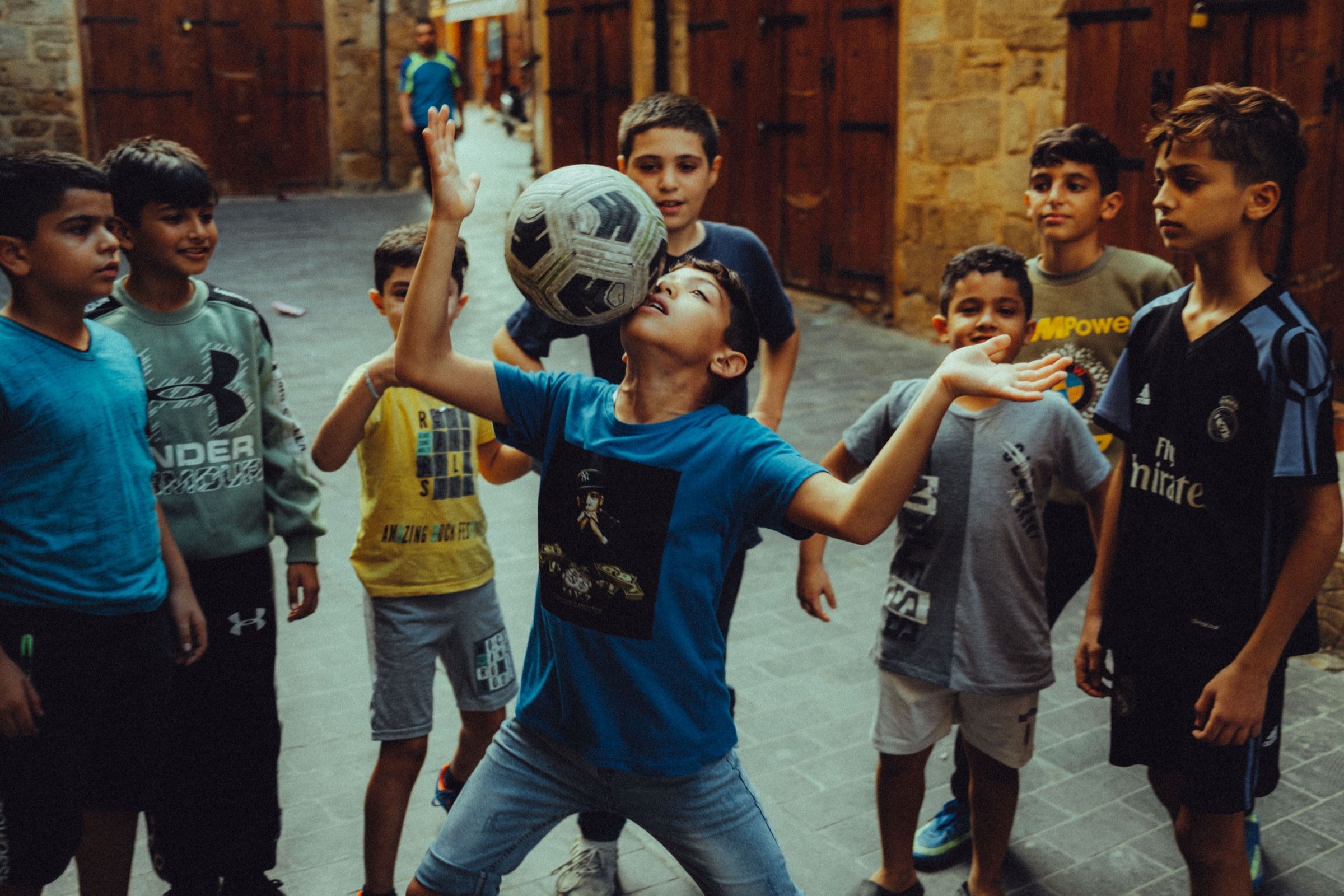 A candid shot of a group of kids playing football in Ancient Sidon, Lebanon.